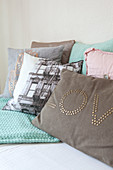 Various cushions with printed and appliqué motifs