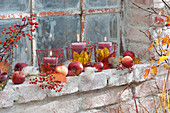 Autumnal candle deco at barn window