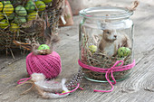 Mini Easter basket in mason jar with Easter bunny, hay and eggs