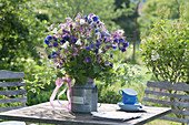 Rural bouquet of Aquilegia and Rubus rods