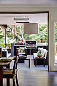 View from the dining area onto the living terrace with outdoor kitchen
