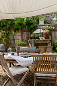 Garden table and chairs under awning
