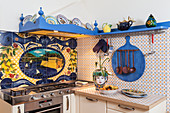 Small Italian kitchen with typically Italian painted tiles
