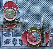 Patterned plates decorated with rosettes on set table