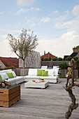 White outdoor furniture on large modern roof terrace