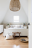 Attic bedroom in white and beige