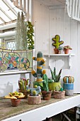 Various crocheted cacti and succulents on veranda