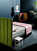Double bed with an individual, green, upholstered bed head
