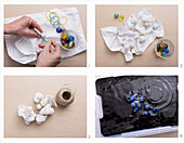 Tischset mit Shibori-Technik färben: Glasmurmeln mit Gummibändern auf dem Stoff fixieren, mit Band umwickeln und in die Farbe tauchen