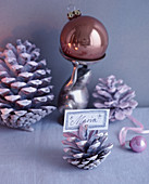 Christmas arrangement with pine cone used as place card holder