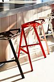 Designer aluminium bar stools at counter