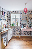 Retro polka-dot wallpaper in eclectic kitchen