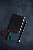 Vintage notebook with hand-made tassels as bookmarks