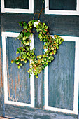 Wreath of hops on wooden door