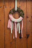 Gypsophila wreath tied with pink and green ribbons