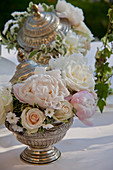 Silver bowl with festive flower arrangement