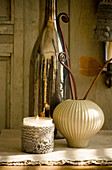 Votive candle lantern with knitted cover, vase and magnum bottle