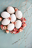 White eggs, roses and twigs
