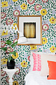 Vintage-style floral wallpaper on accent wall in small bedroom