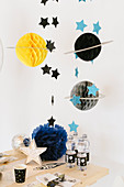 Honeycomb paper planets for space-themed birthday party