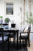 Black garden furniture on Scandinavian-style terrace