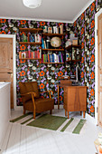 Work area in hallway with colourful floral wallpaper