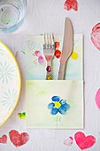 Cutlery pouch painted with colourful flowers for child's birthday party