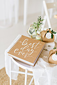 Wedding book, flowers in geometric vase and gift boxes