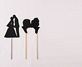 Bride and groom decorations hand-made from black card
