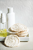 Facial cleansing pads hand-crocheted from white cotton yarn