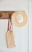 Hat and bag on rustic coat rack
