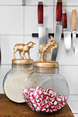 Sweet jars with animal figurines on lids