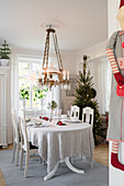 Set table in festively decorated dining room