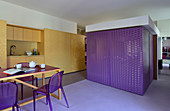 Modern studio apartment with purple accents
