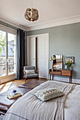 Vintage furniture in bedroom of Parisian period building