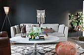 Bohemian-style living room with black wall