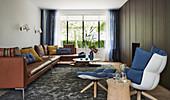 Masculine living room in earthy shades with blue accents