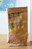 Paper bag printed with pattern of anchors (DIY foam rubber stamp)