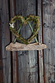 Heart made from moss and lichen with edelweiss flower and wooden pendant