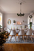 Set dining table in festively decorated dining room