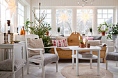 Christmas tree in Scandinavian-style conservatory