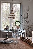 Set dining table with Christmas decorations made from natural materials