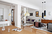 View across dining table into lounge split into two sections