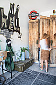 Wardrobe made from reclaimed wood and graffiti on wall in teenager's bedroom