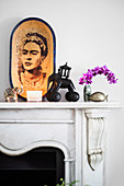 Bowl with Frida Kahlo motif and elephant figures on mantelpiece