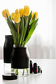 Tulips in vase made from jar and black adhesive film
