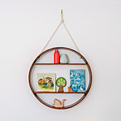 Round wall shelf with antroposophical wooden toys