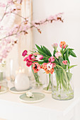 Glass vase of tulips on Easter table