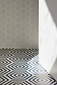 Honeycomb-patterned floor tiles in bathroom (detail)