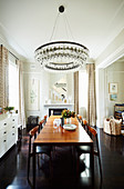Elegant dining area with a long table and chandelier